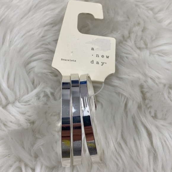 a new day Jewelry - 4/$20 A New Day Set of 3 Silver Tone Bangle Bracelets